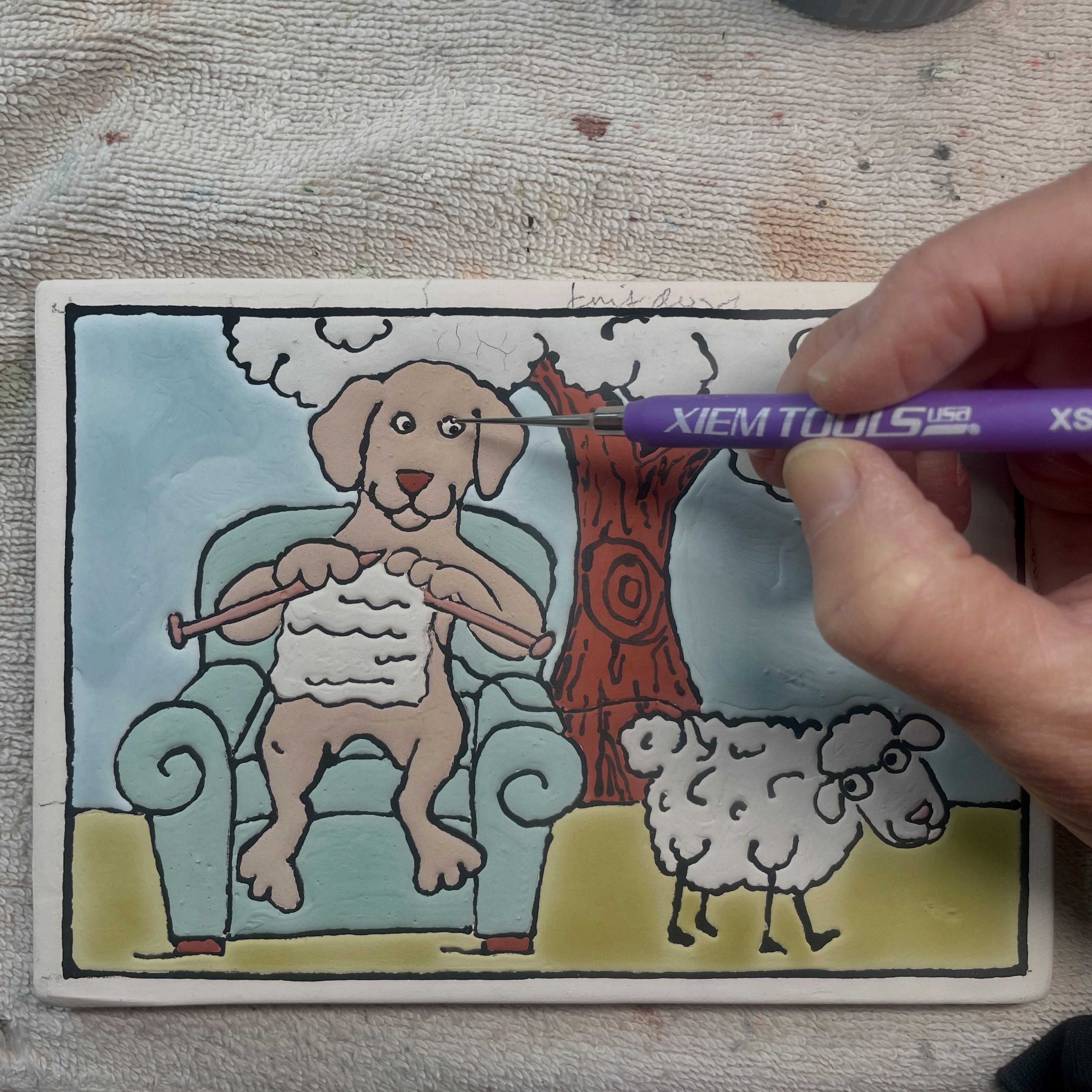 Getting those eyes just right with my Xiem stylus on this 5x7” handmade tile.  #ramonapalomatile #handmadetiles #knit #dog